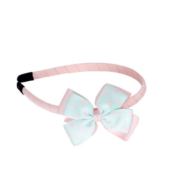 Cài tóc bé gái dính nơ in hình chấm bi